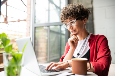 Woman by Window Red Desk