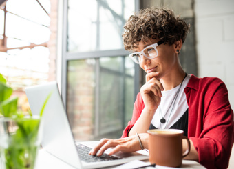 Woman by Window Red Desk