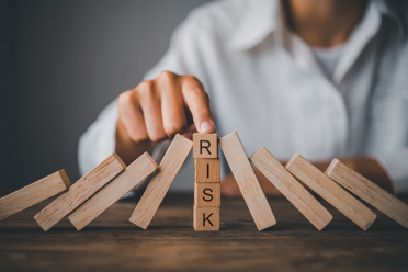 Wooden blocks that spell RISK