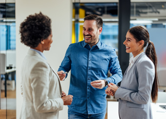 Three happy people at office