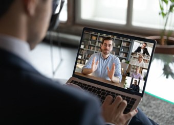 Person watching a webinar on computer