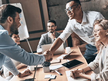 men exchanging a handshake