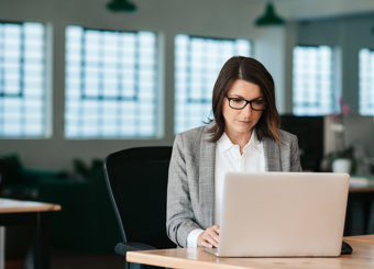 Business Woman Working by Computer