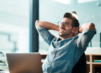 man leaning back on chair