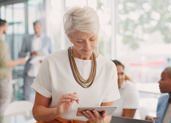 Mature Business Woman Working Device