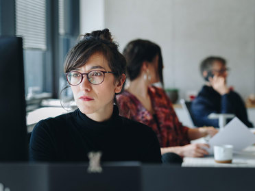 business professional looking at computer monitor